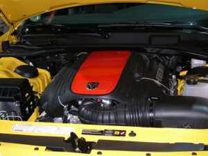 : ASE-certified mechanic performing engine diagnostics on a Dodge Charger in Bellingham